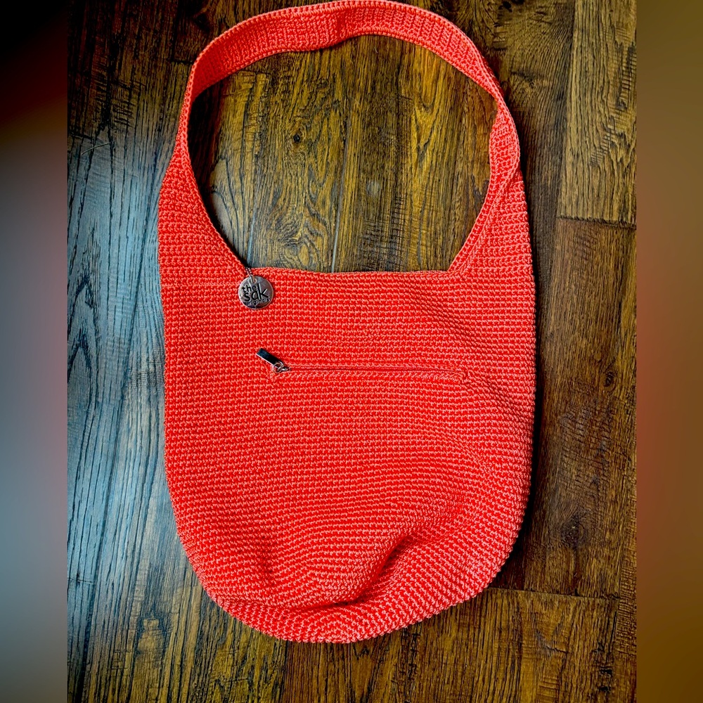 The Sak, woven peach hobo bag.
